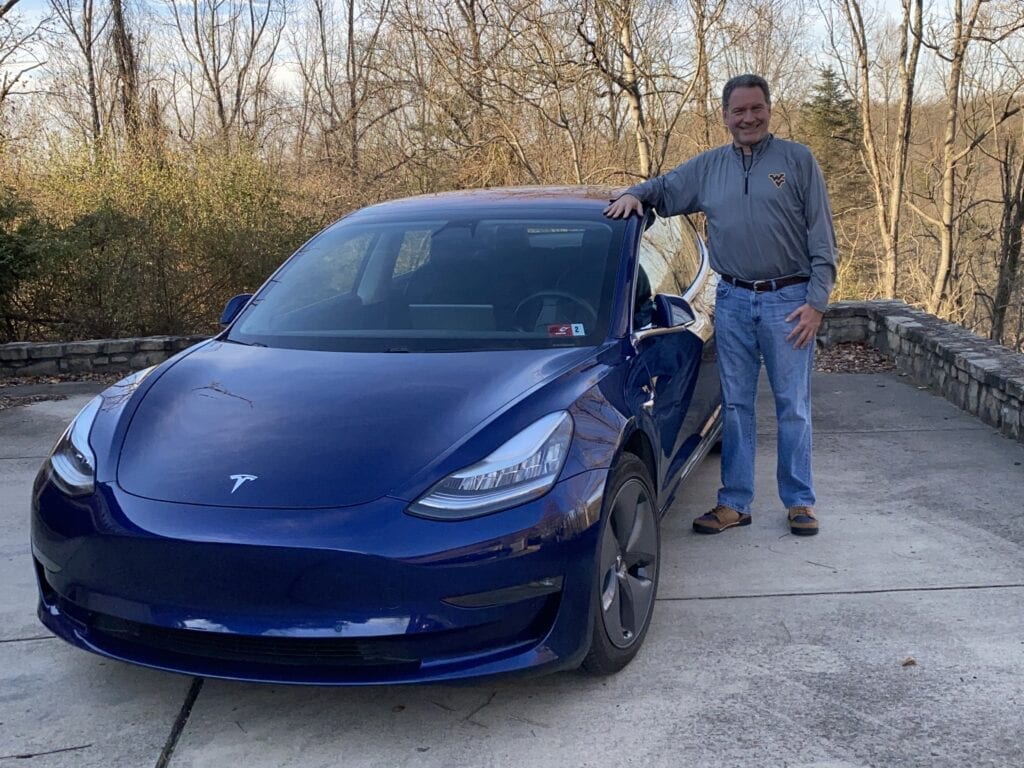 Photo: CentralApp CEO and his Tesla before embarking on Operation: Rural Tech